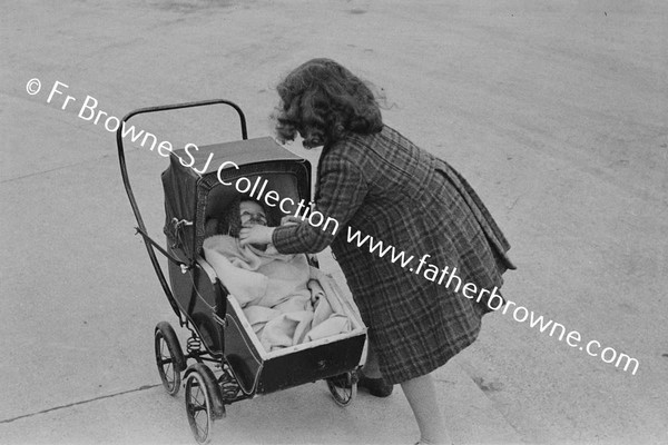 CHILD WITH DOLL'S PRAM